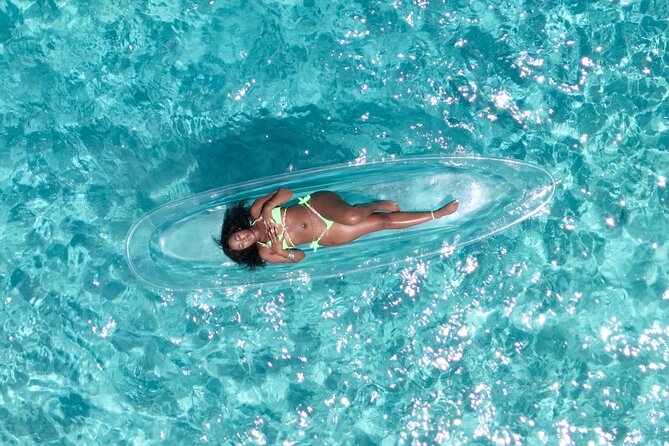 Clear Kayaks Drone Photoshoot in Nassau,Bahamas. - Getting into the clear kayak
