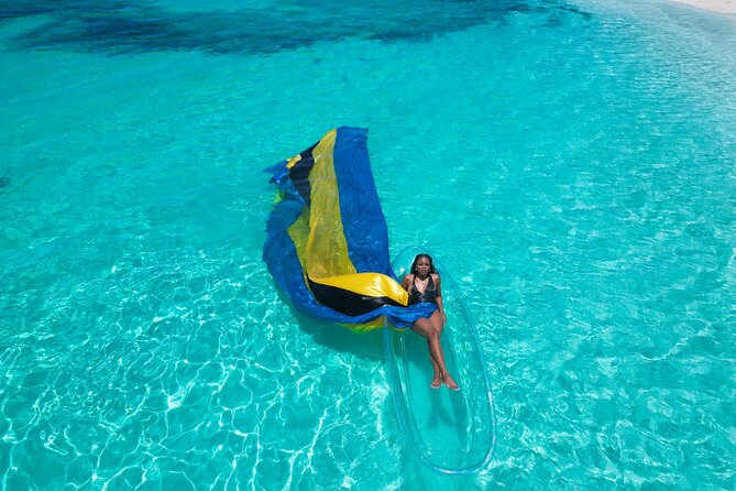 Nassau Clear Kayak Drone Photoshoot- Floating Dress - Getting into the clear kayak